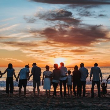 family outside on a beach 